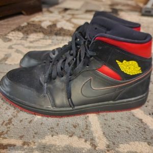 Nike Air Jordan black and red with yellow insignia